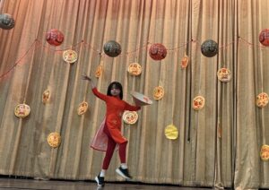 Student performing a Vietnamese Lotus Dance